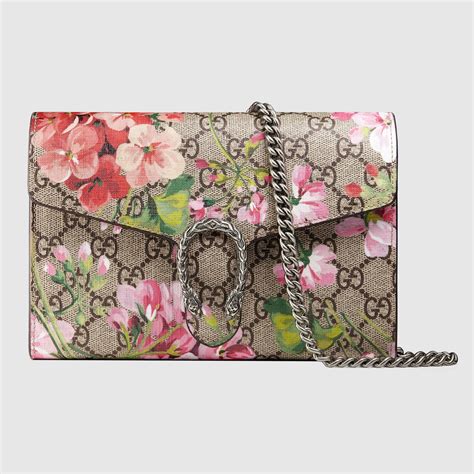 gucci purse with pink flowers.